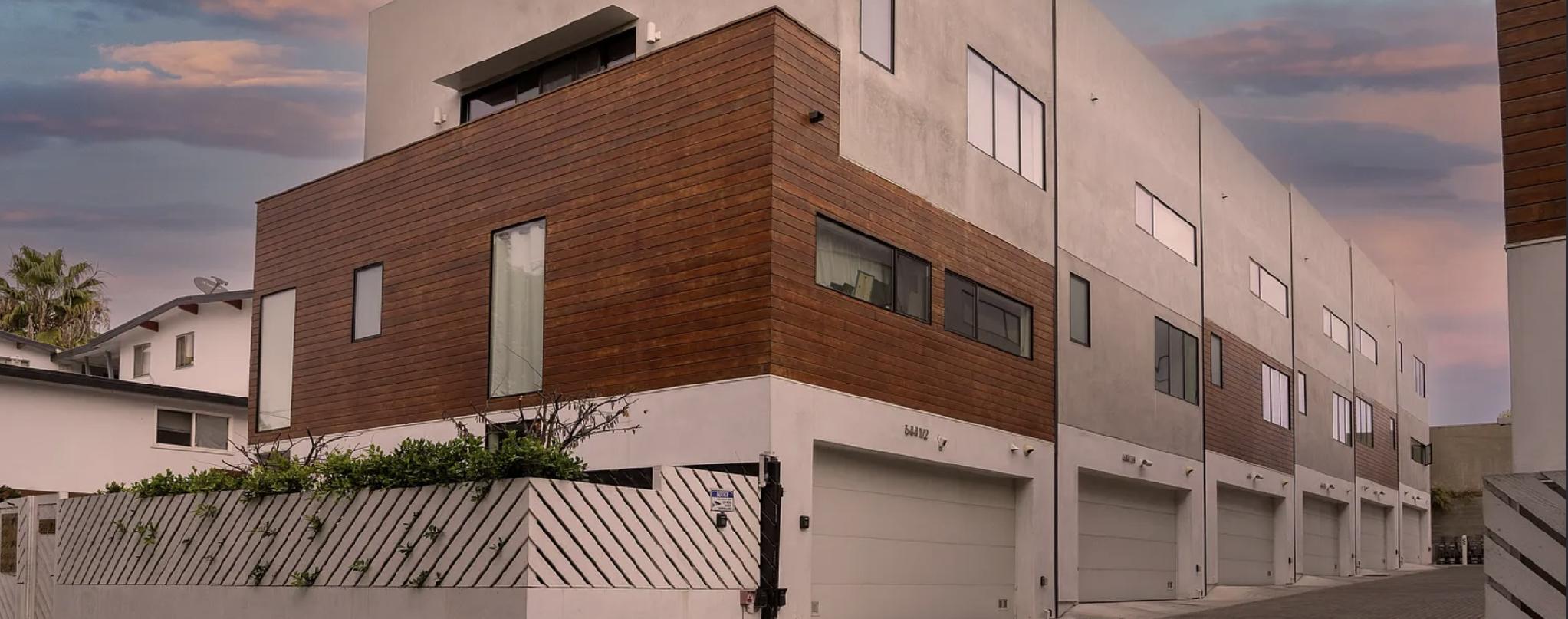 646 N. Commonwealth Avenue, a wood- and stucco-clad small lot subdivision in Silver Lake, at dusk